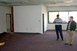 Fire Inspector Duane Lemons inspects a building under renovation for fire safety standards. CCFD photo.