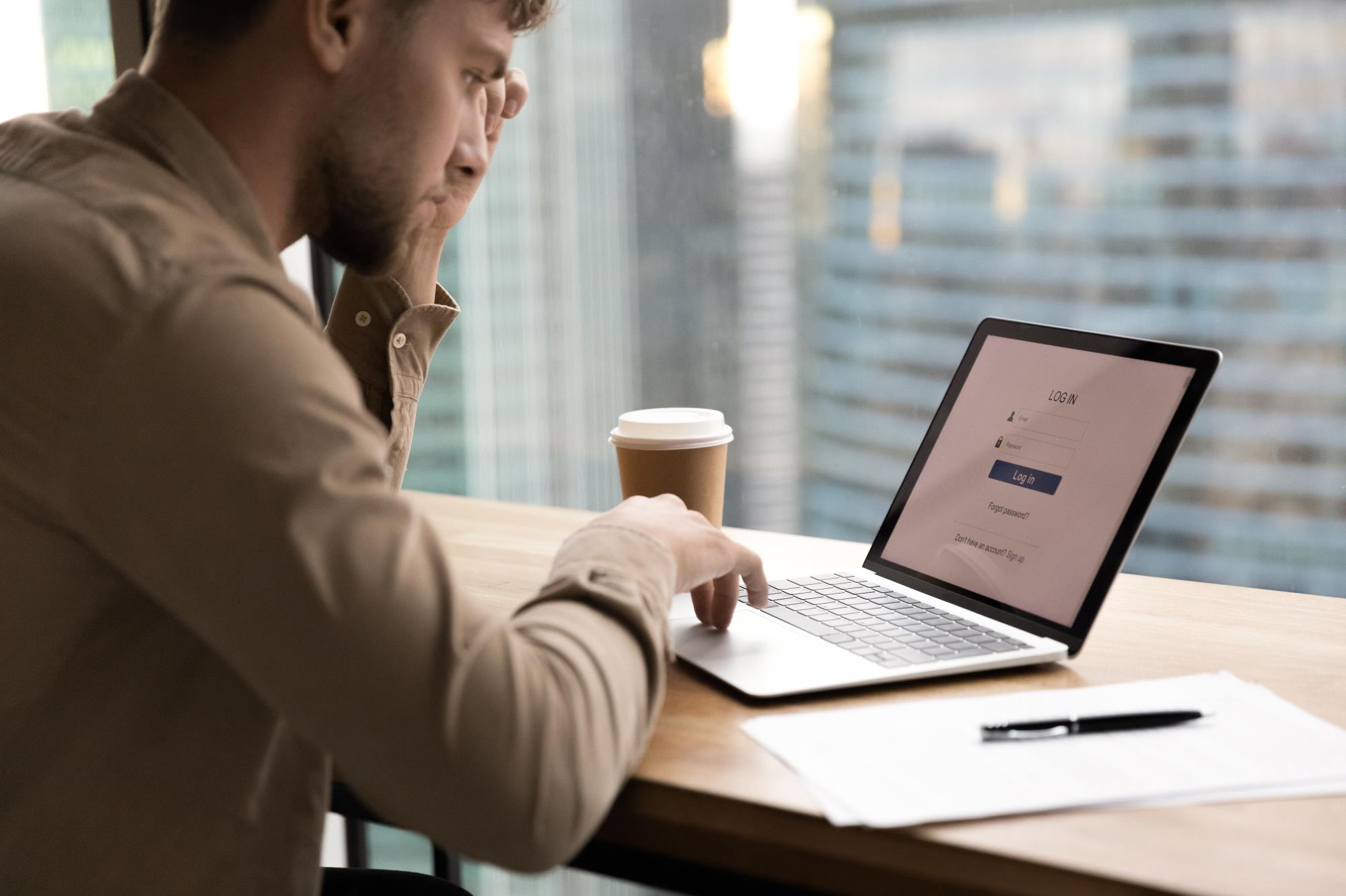 Person looking at computer to Sign in.